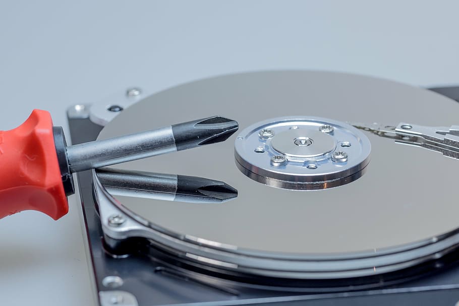 HD wallpaper: red handled screwdriver on gray surface, hard drive, hdd ...